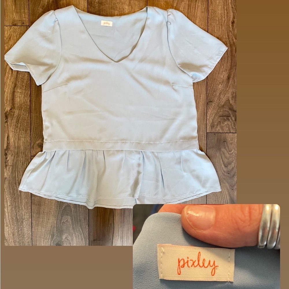 Baby blue blouse.